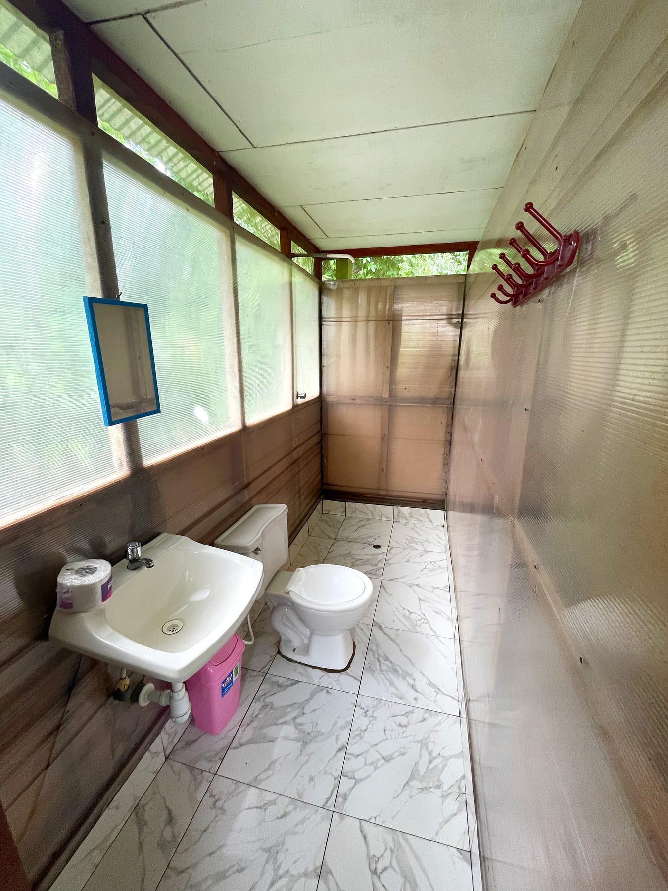 Private en-suite bathroom with white tile at Brisa Tropical Eco-Lodge